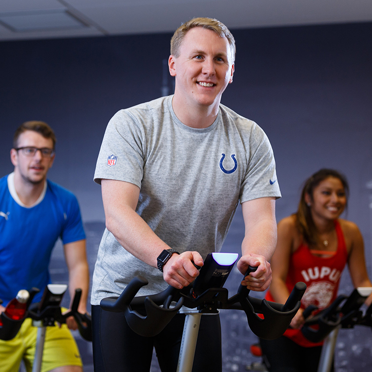 Students in a cycling class in the fitness center.